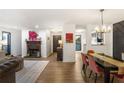 Open concept living room with fireplace and dining area at 210 Woodcliff Dr, Atlanta, GA 30350