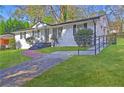 Quaint home featuring white painted brick and a green lawn at 3001 Will Rogers Se Pl, Atlanta, GA 30316