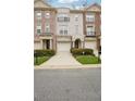 Charming townhomes with brick and stucco exteriors, featuring attached garages and inviting entrances at 1186 Arbor Park Sw Ln, Atlanta, GA 30311