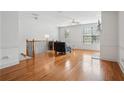 Bright living room with hardwood floors, crown molding, and a cozy seating arrangement at 1186 Arbor Park Sw Ln, Atlanta, GA 30311