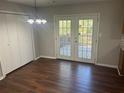 Cozy dining area with French doors to a deck and plenty of natural light, ready for entertaining at 2039 Corners Cir, Lithonia, GA 30058