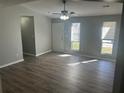 Bright living room with large windows, new floors, and neutral paint, a wonderful living space at 2039 Corners Cir, Lithonia, GA 30058