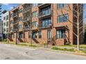 Brick condominium building with multiple levels and private balconies at 22 Airline Ne St # 204, Atlanta, GA 30312