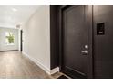 Hallway features a door and window with lots of light and laminate floors at 22 Airline Ne St # 204, Atlanta, GA 30312