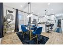 Open dining area with modern light fixtures and a dining table at 503 Mcwilliams Se Rd, Atlanta, GA 30315