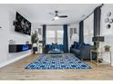 Modern living room with sleek furniture, a large TV, and stylish decor at 503 Mcwilliams Se Rd, Atlanta, GA 30315