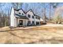 Attractive two-story home featuring stylish black trim and professional landscaping on a spacious lot at 1205 Cottonwood Se Grv, Conyers, GA 30094
