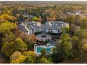Aerial shot showing condo community, pool, surrounded by lush greenery at 3101 Howell Mill Nw Rd # 201, Atlanta, GA 30327