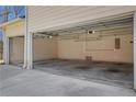 Spacious three-car garage with ample storage space and neutral paint throughout at 3485 Walnut Rdg, Atlanta, GA 30349