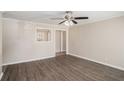 Spacious living room with hardwood floors, neutral paint, and a view into adjacent rooms at 10164 Sunny Sw Dr, Covington, GA 30014