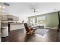 Open living space features a modern kitchen, hardwood floors, and a comfortable seating area at 1180 Cades Walk, Lawrenceville, GA 30045