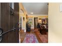 Inviting foyer with hardwood floors and arched doorway leading to a view of the staircase and living areas at 1620 N Pelham Ne Rd, Atlanta, GA 30324