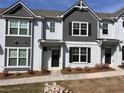Modern townhome with a painted brick facade and dark accents at 1812 Emory Ln # 93, Conyers, GA 30013
