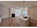 Open-concept living room features a fireplace and flows into the kitchen at 1812 Emory Ln # 93, Conyers, GA 30013