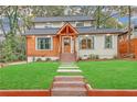 Inviting home exterior with a well-kept lawn, wood accents and a welcoming entrance at 3637 Elm St, Atlanta, GA 30354