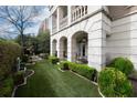 This backyard features manicured landscaping, elegant stone columns and a quaint place to sit and relax at 2440 Peachtree Nw Rd # 1, Atlanta, GA 30305