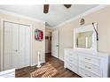 Bright bedroom featuring wood floors, white trim and neutral wall color at 2019 Wiltshire Pl, Snellville, GA 30078