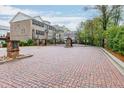 Gated community entrance with brick pillars and paving, offering security and a welcoming sense of arrival at 2022 Raven Way, Atlanta, GA 30341