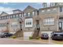 Charming brick townhome with a private garage, landscaped entryway, and a classic architectural design at 2022 Raven Way, Atlanta, GA 30341