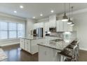 Bright kitchen boasting white cabinetry, stainless steel appliances, and granite countertops at 2022 Raven Way, Atlanta, GA 30341