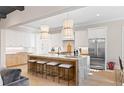 Beautiful kitchen featuring stainless appliances, marble countertops, an island with seating, and custom cabinetry at 2591 Apple Valley Rd, Brookhaven, GA 30319
