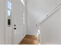 Bright foyer with light wood floors and a stairway at 1661 Paddlewheel Dr, Marietta, GA 30062