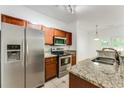 Modern kitchen with stainless steel appliances, granite countertops, and wood cabinets at 2520 Laurel Nw Cir, Atlanta, GA 30311