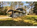 Lovely two-story home featuring a convenient carport and well-maintained yard at 5505 Longmeadow Ln, College Park, GA 30349
