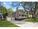 Two-story home featuring a two-car garage and a charming front porch at 109 Bowen Sw Cir, Atlanta, GA 30315