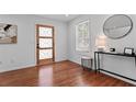 Bright entryway with wood floors, decorative front door, and stylish console table at 382 Deckner Sw Ave, Atlanta, GA 30310