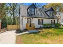 Inviting two-story home featuring fresh landscaping, a new fence, and updated curb appeal at 382 Deckner Sw Ave, Atlanta, GA 30310