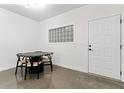 Dining room with table, four chairs, a window and an exterior door at 400 17Th Nw St # 1133, Atlanta, GA 30363