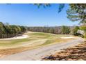 Scenic golf course view with green fairway, white sand traps, and mature trees at 1037 Windermere Xing, Cumming, GA 30041