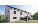 Side exterior showcasing the modern two-story white siding with black framed windows, and green yard at 2650 Roswell Rd, Marietta, GA 30062