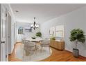 Cozy dining room with a round table, chandelier, and hardwood floors at 1687 Briarcliff Ne Rd # 8, Atlanta, GA 30306