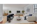Bright living room with modern furniture, hardwood floors, and a large window at 1687 Briarcliff Ne Rd # 8, Atlanta, GA 30306