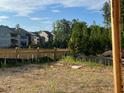 A partially cleared lot with newly built fencing, ready for landscaping and development at 1243 Lakeside Overlook, Canton, GA 30114
