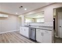 Bright kitchen showcasing subway tile backsplash, stainless steel dishwasher, and granite countertop at 54 Jean Ct, Hiram, GA 30141