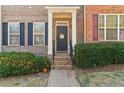 Inviting front entry with a brick pathway, showcasing the home's lovely facade at 1525 Endurance Hill Dr # 6, Kennesaw, GA 30152