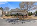 Inviting home with a manicured front yard, showcasing neat landscaping and a charming entryway at 281 Hiawassee Dr, Woodstock, GA 30188