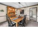 The charming dining area features a farmhouse table, rustic hutch and modern light fixture at 1945 Wenlok Ne Trl, Marietta, GA 30066