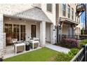 Relaxing outdoor patio with seating area and manicured lawn, perfect for enjoying the outdoors at 520 Clover Ln, Alpharetta, GA 30009