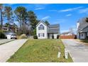 Inviting two-story home with a manicured lawn and private driveway, creating a warm curb appeal at 16 Montclair Ct, Cartersville, GA 30121