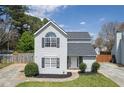 Beautiful two-story home featuring fresh landscaping, gray siding, and a freshly sealed driveway at 16 Montclair Ct, Cartersville, GA 30121