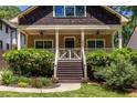 Charming bungalow featuring a cozy front porch, shingled gable, and well-maintained landscaping at 2628 White Oak Dr, Decatur, GA 30032