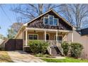 Inviting craftsman home showcasing a covered front porch and landscaped yard at 2628 White Oak Dr, Decatur, GA 30032