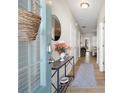 Welcoming foyer featuring wood floors, console table, and a view into the living area at 353 Franklin Ln, Acworth, GA 30102