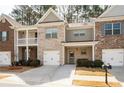 Beautiful townhomes with brick and siding, showcasing well-manicured landscaping and inviting entries at 353 Franklin Ln, Acworth, GA 30102