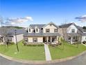 Aerial view of a lovely home with manicured lawn and inviting front porch in a friendly neighborhood at 5034 Little Harbor Way, Acworth, GA 30101