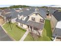 Beautiful home featuring manicured lawn in a Gathering-friendly neighborhood; aerial view at 5034 Little Harbor Way, Acworth, GA 30101